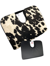 Tush-Cush® Black and white cow print features a wedge shape and tailbone cut-out relieves pain